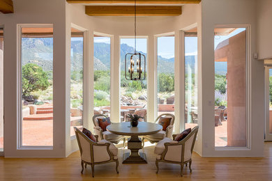 Dining room - mid-sized transitional light wood floor dining room idea in Atlanta with white walls