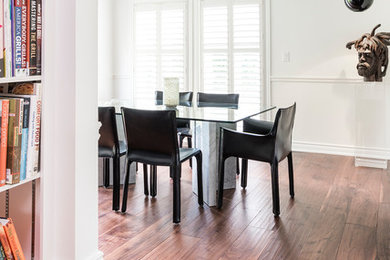 Dining room - transitional medium tone wood floor and brown floor dining room idea in Toronto with white walls