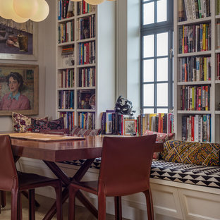 Dining room - eclectic medium tone wood floor and brown floor dining room idea in New York with gray walls