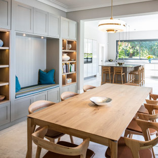 Large traditional kitchen/dining room in London with grey walls, concrete flooring and grey floors.
