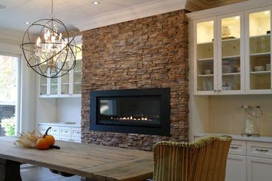 Large transitional dark wood floor kitchen/dining room combo photo in Toronto with white walls, a standard fireplace and a stone fireplace