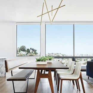 Great room - mid-sized 1950s light wood floor and beige floor great room idea in San Francisco with white walls and no fireplace