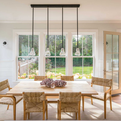Kitchen/dining room combo - mid-sized scandinavian light wood floor and gray floor kitchen/dining room combo idea in Boston with no fireplace and beige walls
