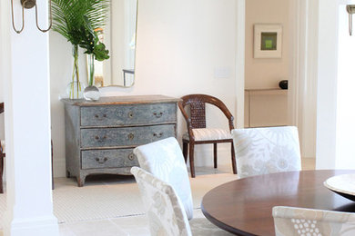 Photo of a scandinavian dining room in Miami with white walls, limestone flooring and beige floors.