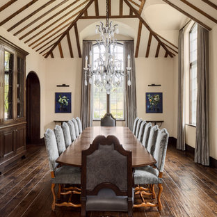 Imagen de comedor tradicional, extra grande, cerrado, con paredes beige, suelo de madera oscura y suelo marrón