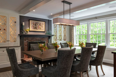 Inspiration for a mid-sized timeless dark wood floor and brown floor kitchen/dining room combo remodel in Boston with gray walls, a standard fireplace and a brick fireplace
