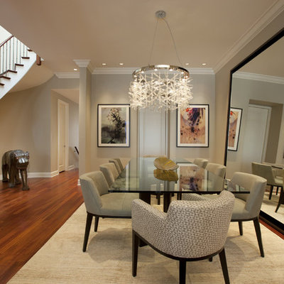 Example of a trendy dark wood floor and brown floor dining room design in Chicago with beige walls