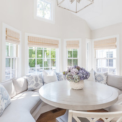 Inspiration for a small coastal medium tone wood floor dining room remodel in Boston with beige walls and no fireplace