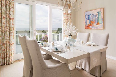 This is an example of a small beach style open plan dining room in New Orleans with grey walls, carpet, no fireplace and beige floors.