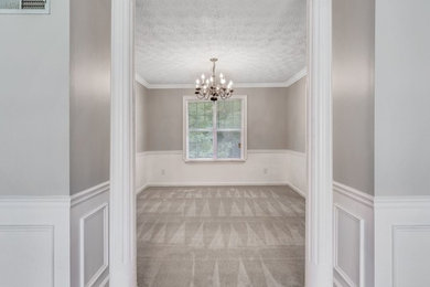 Mid-sized transitional carpeted and gray floor enclosed dining room photo in Atlanta with gray walls and no fireplace