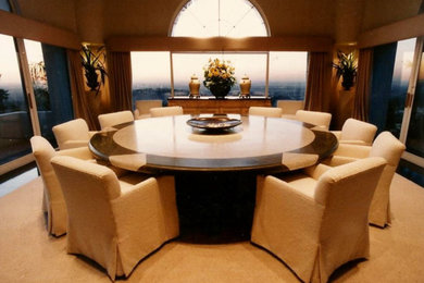 Large elegant brown floor enclosed dining room photo in San Diego with brown walls