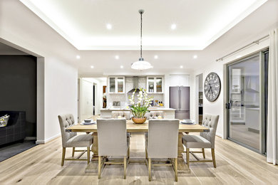 Inspiration for a mid-sized transitional light wood floor great room remodel in Toronto with gray walls
