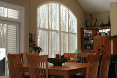Photo of a medium sized classic kitchen/dining room in Grand Rapids with beige walls and carpet.
