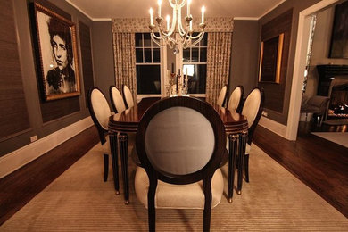 Inspiration for a large dark wood floor enclosed dining room remodel in Chicago with gray walls