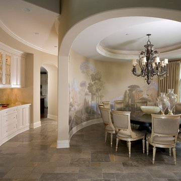 Oval dining room with luxurious curved Butler's Pantry Cabinetry