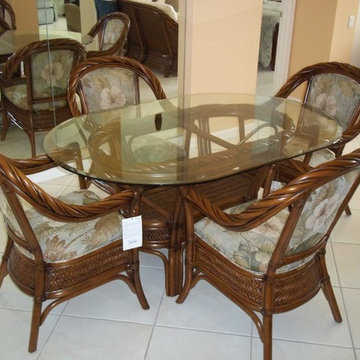 OVAL GLASS TOP DINING TABLE WITH RATTAN CHAIRS