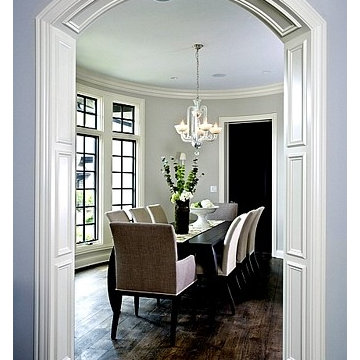 Oval Shape Dining Room with Recessed Panel Arched Cased Openings