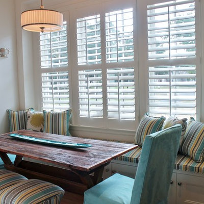 Inspiration for a small timeless light wood floor and brown floor kitchen/dining room combo remodel in Charlotte with white walls and no fireplace