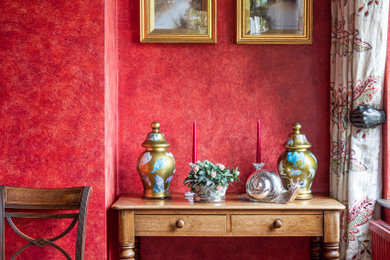Photo of a large traditional dining room in Oxfordshire with red walls.