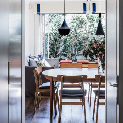 Example of a trendy dark wood floor dining room design in Sydney