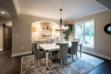 Example of a transitional dining room design in Other