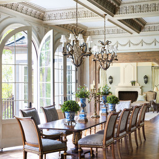 Example of an ornate medium tone wood floor dining room design in Minneapolis