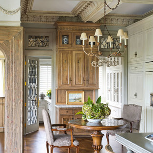 Example of a small ornate medium tone wood floor kitchen/dining room combo design in Minneapolis with no fireplace