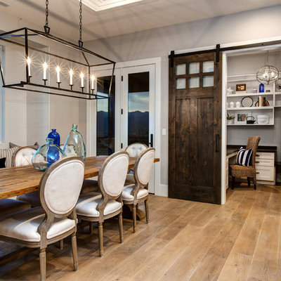Example of a beach style light wood floor kitchen/dining room combo design in Salt Lake City with gray walls