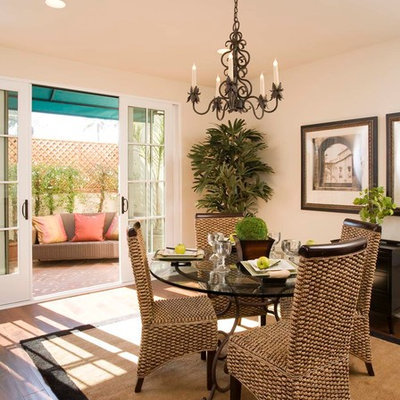 Inspiration for a small mediterranean dark wood floor great room remodel in Santa Barbara with beige walls and no fireplace