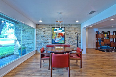 Great room - large mid-century modern medium tone wood floor great room idea in Dallas with white walls