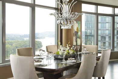 This is an example of a contemporary dining room in Portland with dark hardwood flooring.