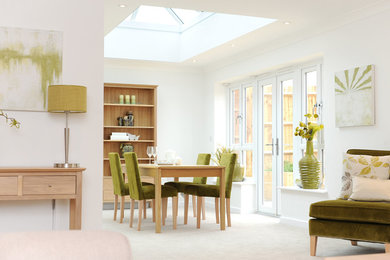 This is an example of a contemporary dining room in Kent.