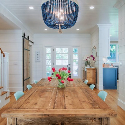 Inspiration for a mid-sized farmhouse light wood floor and beige floor kitchen/dining room combo remodel in San Francisco with white walls and no fireplace