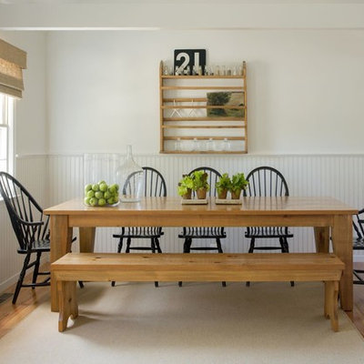 Beach style medium tone wood floor dining room photo in Boston with white walls and no fireplace