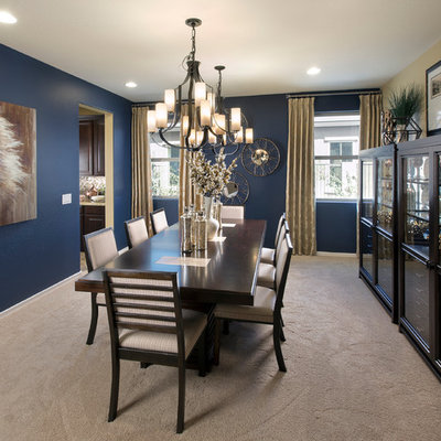 Elegant carpeted enclosed dining room photo in Phoenix with blue walls