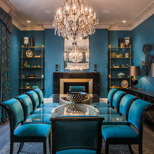 Contemporary enclosed dining room in London with blue walls, dark hardwood flooring, a standard fireplace and grey floors.