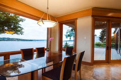 This is an example of a large contemporary kitchen/dining room in Seattle with beige walls and no fireplace.