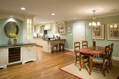 Inspiration for a mid-sized timeless medium tone wood floor and brown floor kitchen/dining room combo remodel in DC Metro with blue walls and no fireplace