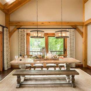 Dining room - rustic dark wood floor and brown floor dining room idea in Columbus with gray walls