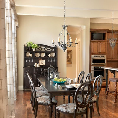 Kitchen/dining room combo - traditional dark wood floor and brown floor kitchen/dining room combo idea in St Louis with beige walls