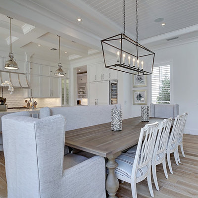 Large transitional light wood floor and brown floor kitchen/dining room combo photo in Miami with white walls and no fireplace