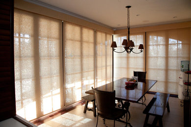 Example of a country dining room design in New York
