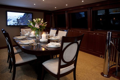 This is an example of a medium sized traditional dining room in Vancouver with carpet and beige floors.