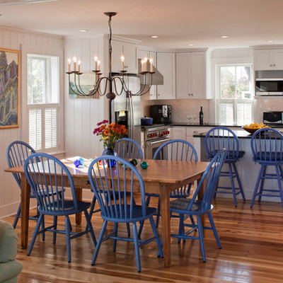 Great room - mid-sized coastal medium tone wood floor great room idea in Boston with beige walls and no fireplace