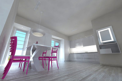 Esempio di una sala da pranzo aperta verso la cucina design di medie dimensioni con pareti bianche e pavimento in laminato