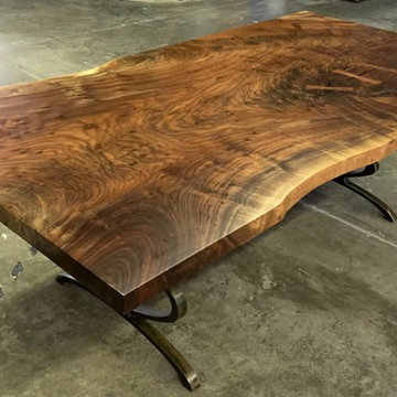 Raw edge claro walnut dining table with steel infinty leg