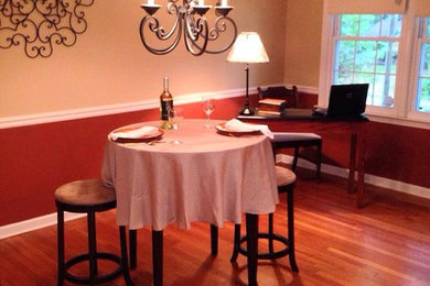 Example of an island style dining room design in Atlanta