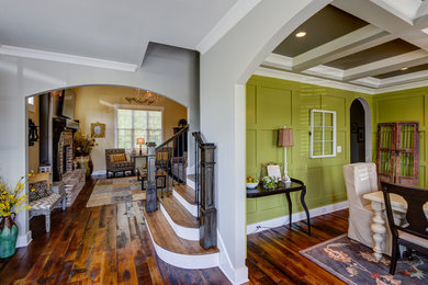 Example of a mid-sized transitional dark wood floor and brown floor enclosed dining room design in Other with green walls and no fireplace