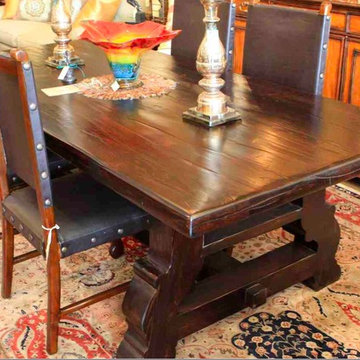 Reclaimed Wood Spanish Trestle Dining Table in a Distressed Dark Stain Finish