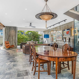 Design ideas for an asian open plan dining in Perth with white walls and grey floor.